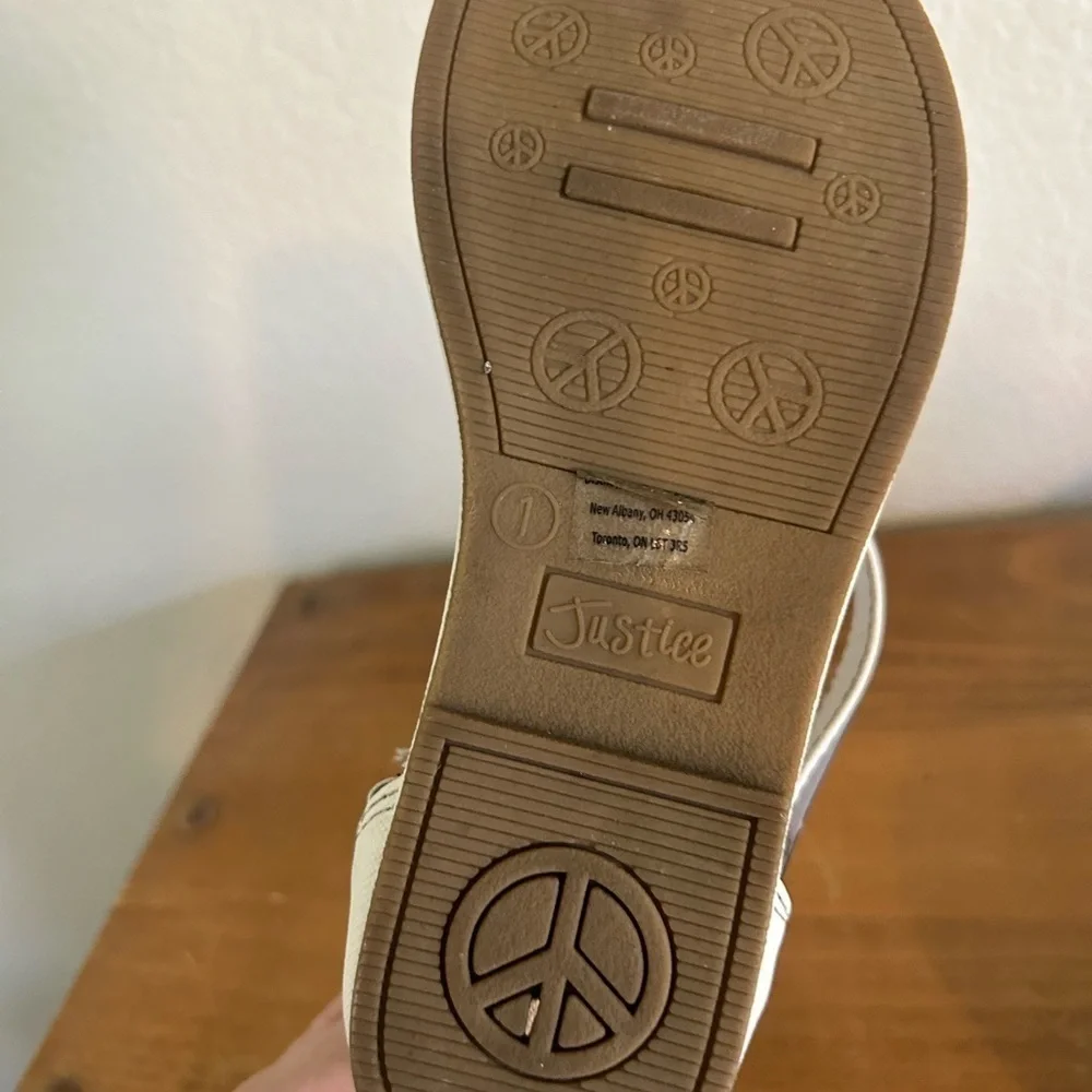 Youth size, one justice, gladiator, white, and silver sandals